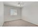 Cozy bedroom featuring neutral walls, carpeted flooring, and a ceiling fan at 830 Binbrook Dr, Henderson, NV 89052