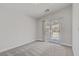 Bright bedroom with neutral carpet and slider door leading to balcony with views at 830 Binbrook Dr, Henderson, NV 89052