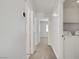 Hallway with access to rooms and a laundry area with a washer and dryer at 830 Binbrook Dr, Henderson, NV 89052