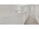 Bright hallway features neutral carpet, natural light, and modern white accents at 830 Binbrook Dr, Henderson, NV 89052
