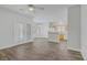 Open living room with wood flooring leading into kitchen area at 830 Binbrook Dr, Henderson, NV 89052