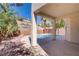 Covered patio featuring stucco columns, brick wall, desert landscape, and a view of a pool at 830 Binbrook Dr, Henderson, NV 89052