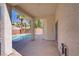 Spacious covered patio with stucco columns offers access to the pool and backyard landscaping at 830 Binbrook Dr, Henderson, NV 89052