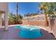 Beautiful backyard pool surrounded by mature trees and a serene setting at 830 Binbrook Dr, Henderson, NV 89052