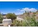 This beautiful view features greenery, blue skies, desert hills, and the city in the distance from the balcony at 830 Binbrook Dr, Henderson, NV 89052