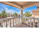 Balcony view showcases a neighborhood with well-maintained homes and lush palm trees at 8454 Mondavi Hill Ct, Las Vegas, NV 89139