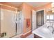 Bathroom featuring dual sinks, a large shower, and an open doorway to another room at 8454 Mondavi Hill Ct, Las Vegas, NV 89139