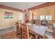 Charming dining room with a rustic wooden table, chandelier lighting, and an inviting atmosphere at 8454 Mondavi Hill Ct, Las Vegas, NV 89139