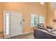 Welcoming entryway showcasing a modern door, neutral wall color, and cozy seating area at 8454 Mondavi Hill Ct, Las Vegas, NV 89139