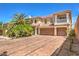 Stunning two-story home with a tile roof, dual garage, and immaculate landscaping at 8454 Mondavi Hill Ct, Las Vegas, NV 89139