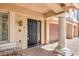Inviting front entrance featuring a black door, brick pathway, and well-maintained landscaping at 8454 Mondavi Hill Ct, Las Vegas, NV 89139
