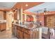An open kitchen with granite countertops, stainless steel appliances, and a view into the living space at 8454 Mondavi Hill Ct, Las Vegas, NV 89139