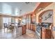A spacious kitchen and breakfast nook featuring stainless steel appliances, granite countertops and tile flooring at 8454 Mondavi Hill Ct, Las Vegas, NV 89139