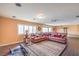 Spacious living room with a large sectional sofa and an elegant area rug at 8454 Mondavi Hill Ct, Las Vegas, NV 89139
