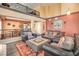 Open-concept living room featuring a balcony view, comfortable seating, and elegant decor at 8454 Mondavi Hill Ct, Las Vegas, NV 89139