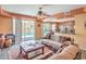 Inviting living room area with sliding glass doors leading to a pool and backyard at 8454 Mondavi Hill Ct, Las Vegas, NV 89139