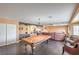 Entertaining space with pool table and ample seating, open to upstairs loft at 8454 Mondavi Hill Ct, Las Vegas, NV 89139