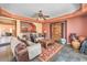 Comfortable living room showcasing a partial view of a wet bar, decorative vases, and a ceiling fan at 8454 Mondavi Hill Ct, Las Vegas, NV 89139