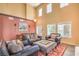 Spacious living room with high ceilings, stylish furniture, and abundant natural light at 8454 Mondavi Hill Ct, Las Vegas, NV 89139