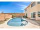 Inviting backyard pool featuring a tanning deck and beautiful landscaping, offering a serene outdoor retreat at 8454 Mondavi Hill Ct, Las Vegas, NV 89139