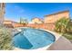 Backyard pool with lush greenery and privacy creates a serene oasis for relaxation and recreation at 8454 Mondavi Hill Ct, Las Vegas, NV 89139