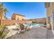 Cozy backyard patio showcases a refreshing pool and a comfortable seating area for relaxing at 8454 Mondavi Hill Ct, Las Vegas, NV 89139