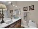 Bathroom featuring a glass vessel sink, framed mirror, and modern fixtures at 8824 Prague Ct, Las Vegas, NV 89147