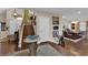 Bright entry area with marble table, stairs leading up, and a view of the kitchen area at 8824 Prague Ct, Las Vegas, NV 89147