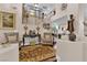 Elegant home entryway with grand staircase, hardwood floors, and decorative accents at 8824 Prague Ct, Las Vegas, NV 89147