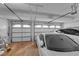 Spacious three car garage with ample lighting, car lift supports, and storage at 8824 Prague Ct, Las Vegas, NV 89147