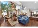Sophisticated living room with an art gallery, a cozy fireplace, and hardwood floors for added charm at 8824 Prague Ct, Las Vegas, NV 89147