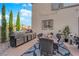 Outdoor kitchen and dining area with stainless steel grill and built-in countertop space at 8824 Prague Ct, Las Vegas, NV 89147