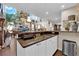 Charming wet bar featuring stylish countertops, cabinet storage, and convenient access to nearby living areas at 8824 Prague Ct, Las Vegas, NV 89147