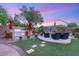 Backyard with an outdoor kitchen and fire pit, perfect for entertaining at 9 Contra Costa Pl, Henderson, NV 89052