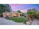 Backyard boasts a covered patio and artificial turf, ideal for relaxation at 9 Contra Costa Pl, Henderson, NV 89052