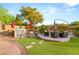 A backyard patio with a built-in grill and a seating area at 9 Contra Costa Pl, Henderson, NV 89052
