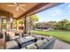 A covered outdoor patio with a view of the manicured backyard at 9 Contra Costa Pl, Henderson, NV 89052