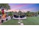 Backyard with fire pit and outdoor seating. Perfect for relaxing evenings at 9 Contra Costa Pl, Henderson, NV 89052