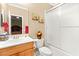 Bathroom with a shower/tub, a wood cabinet and an interior view of a bedroom at 9 Contra Costa Pl, Henderson, NV 89052