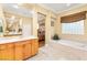 Luxurious bathroom featuring a soaking tub, dual vanity, and abundant natural light, offering a spa-like experience at 9 Contra Costa Pl, Henderson, NV 89052