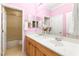 Pink bathroom with a dual sink vanity and separate shower and tub at 9 Contra Costa Pl, Henderson, NV 89052
