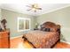 Cozy bedroom featuring a decorative bedspread and a wooden headboard at 9 Contra Costa Pl, Henderson, NV 89052