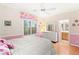 Bright bedroom with pink accents, white furniture, and a sunny window at 9 Contra Costa Pl, Henderson, NV 89052