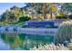 A view of Anthem Country Club's entrance, showcasing a serene pond and stone signage at 9 Contra Costa Pl, Henderson, NV 89052