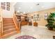 Bright foyer features a wooden staircase, built-in cabinet, and marble floors at 9 Contra Costa Pl, Henderson, NV 89052
