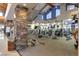 A spacious gym with modern fitness equipment and stone pillars for an upscale workout experience at 9 Contra Costa Pl, Henderson, NV 89052