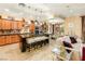 A gourmet kitchen features a large island with seating and dark countertops at 9 Contra Costa Pl, Henderson, NV 89052