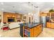 Gourmet kitchen featuring an island bar, dining area, and living space at 9 Contra Costa Pl, Henderson, NV 89052