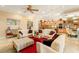 Large living area with tile floors, comfortable seating, a kitchen, dining area and bright open space at 9 Contra Costa Pl, Henderson, NV 89052