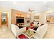 Bright living room with stone wall, fireplace, tile floors, comfortable sofas, and views to other rooms at 9 Contra Costa Pl, Henderson, NV 89052